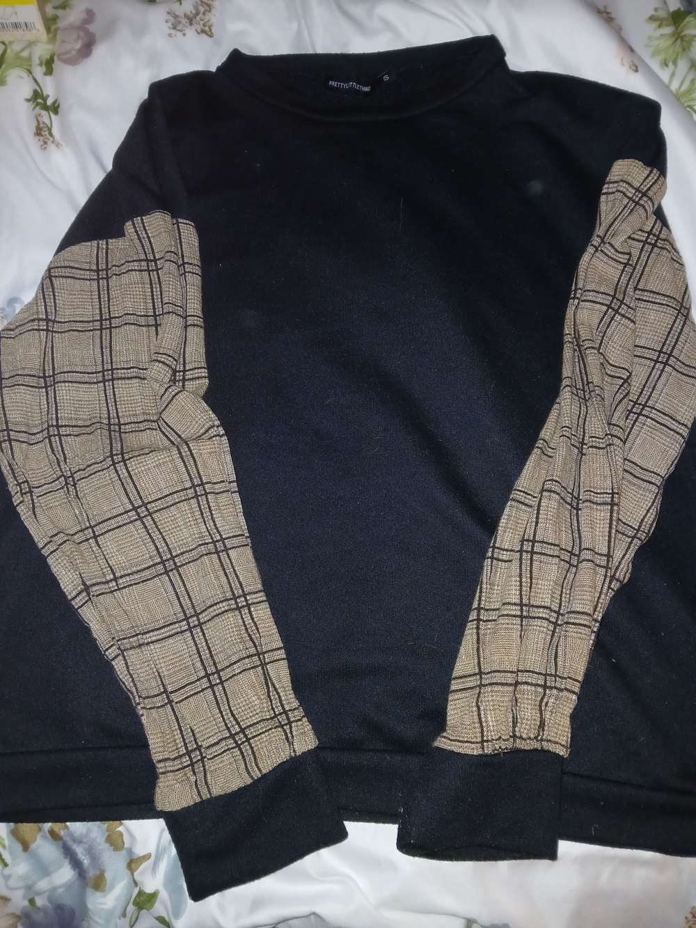 PrettyLittleThing Black Crewneck Sweater with Tan Plaid Sleeves